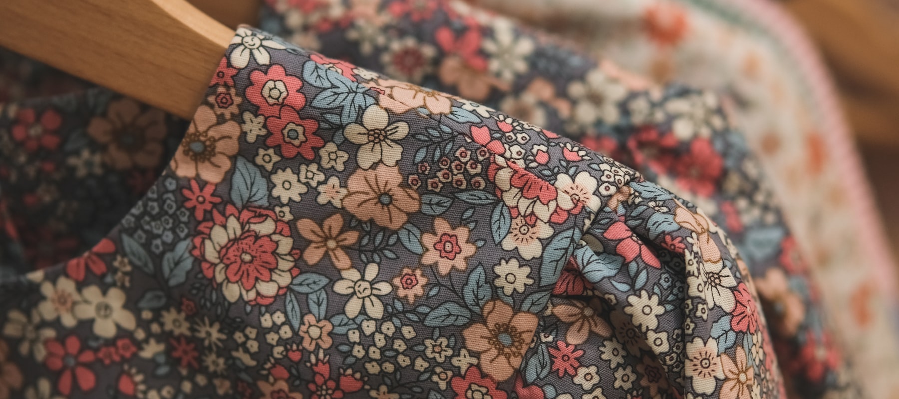 Printed cotton shirts hanging on a rail